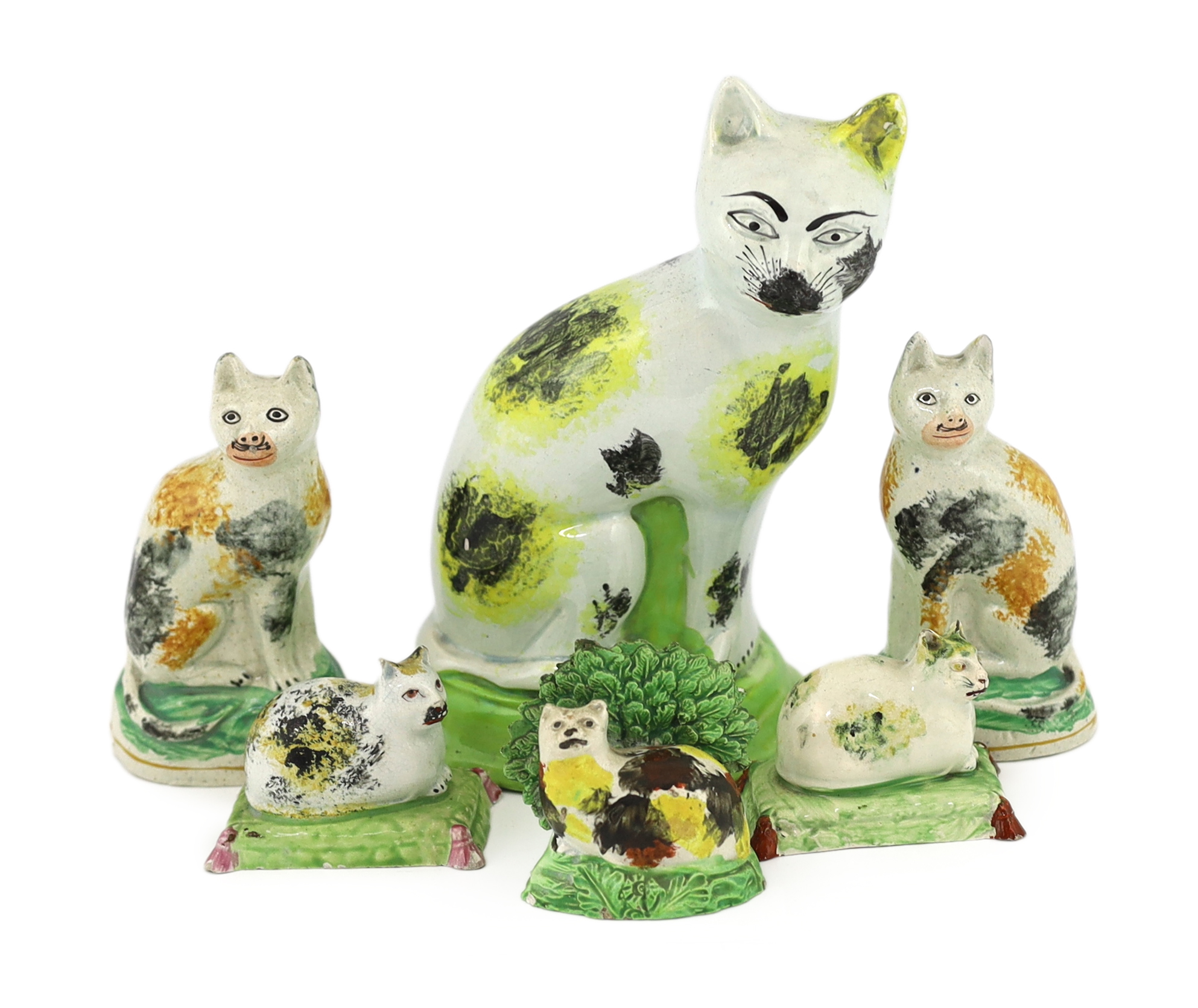 Six Staffordshire pearlware models of cats, early 19th century